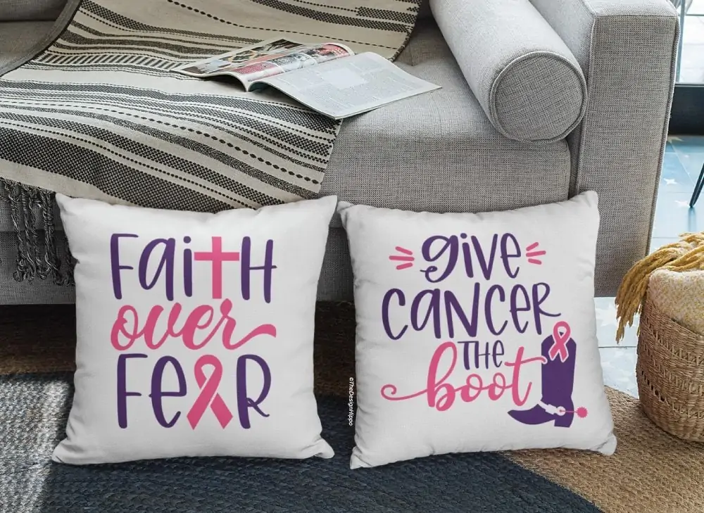 display of free breast cancer awareness SVG designs on two white pillows