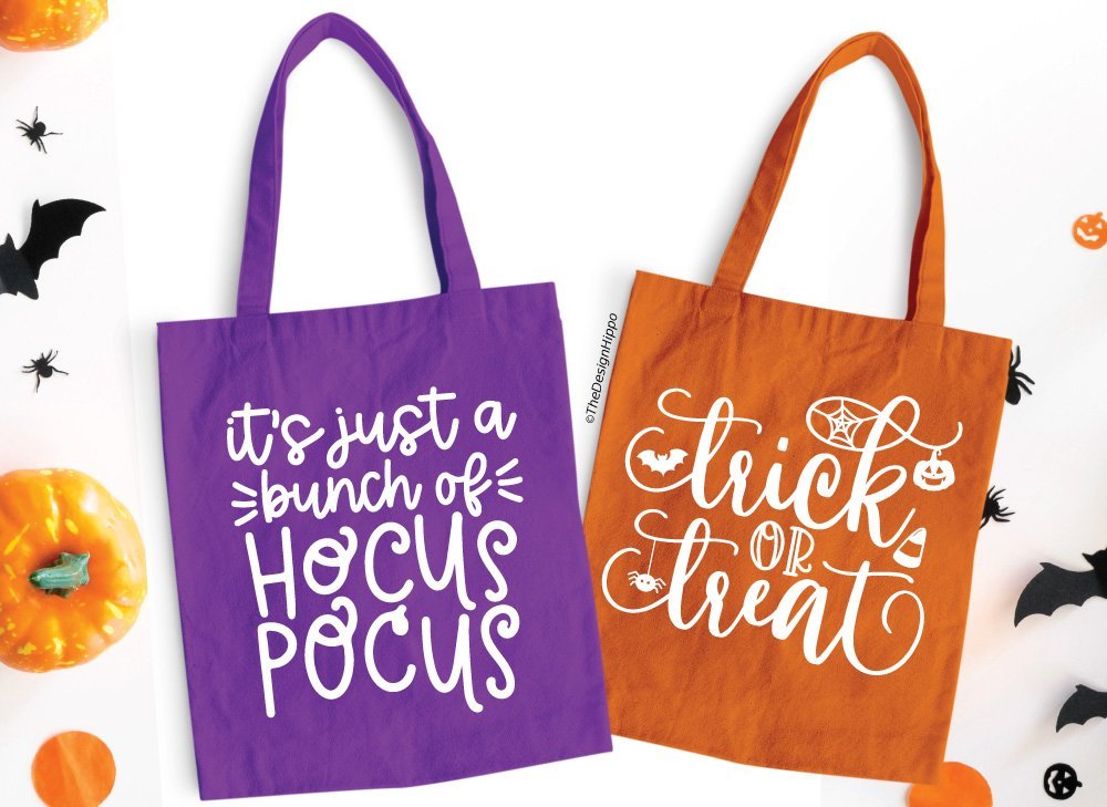 set of two bright colored tote bags with free halloween SVG designs made using a Cricut cutting machine
