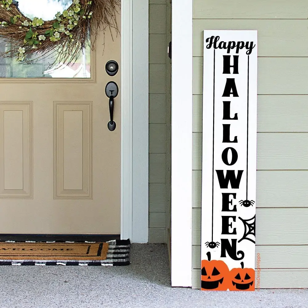 display of free happy Halloween SVG design on a white vertical wood sign