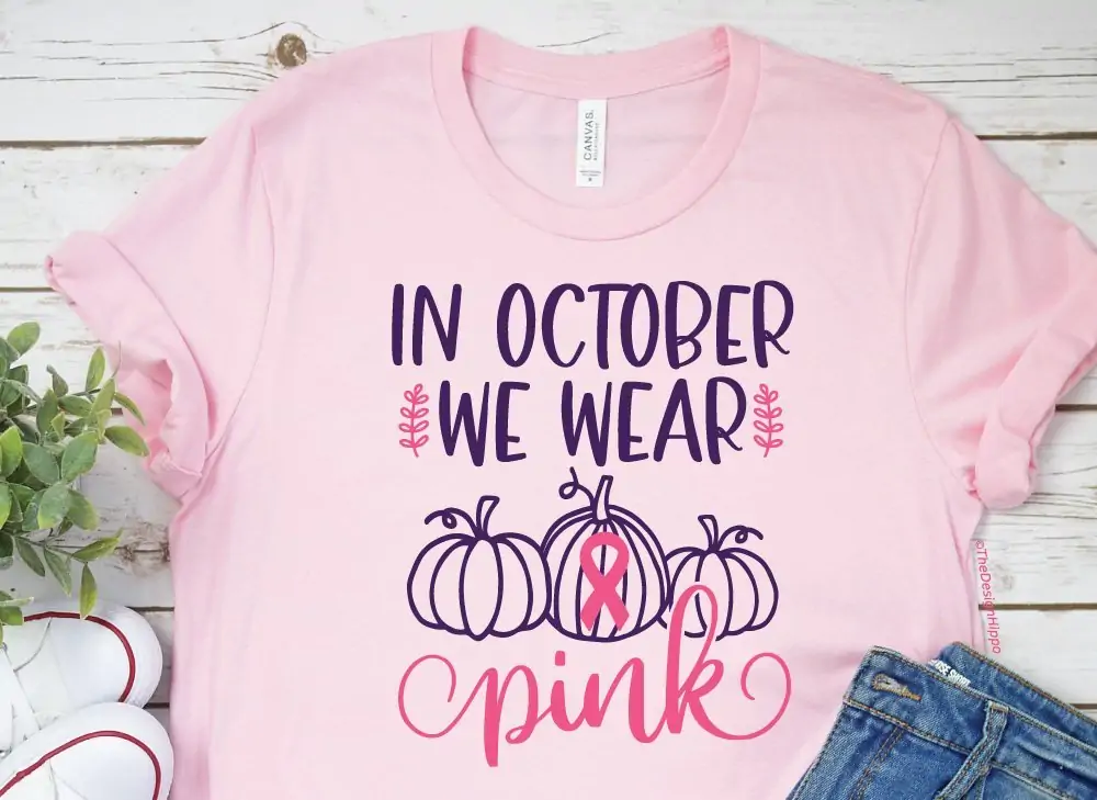 free breast cancer SVG design displayed on a light pink t-shirt made using a Cricut Maker