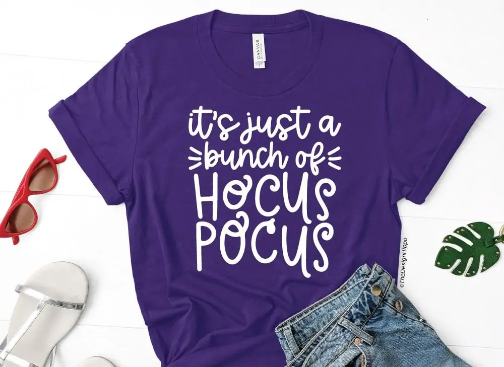 display of free halloween SVG design, it's just a bunch of hocus pocus, on a purple colored t-shirt