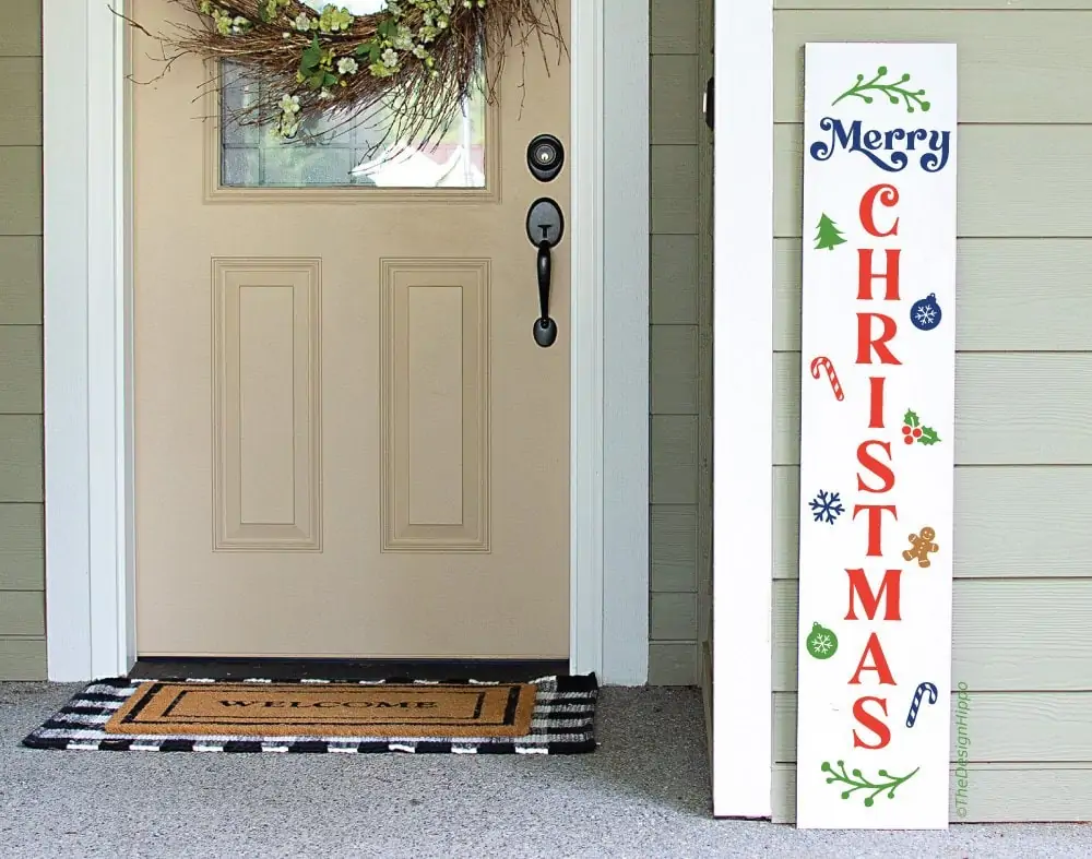 colorful merry Christmas porch sign SVG design displayed on a white vertical wood sign