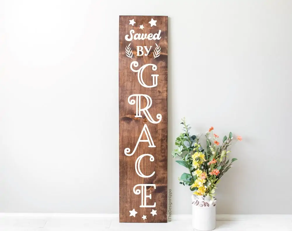 free faith SVG design, saved by grace, on a vertical wood sign made with Cricut Maker