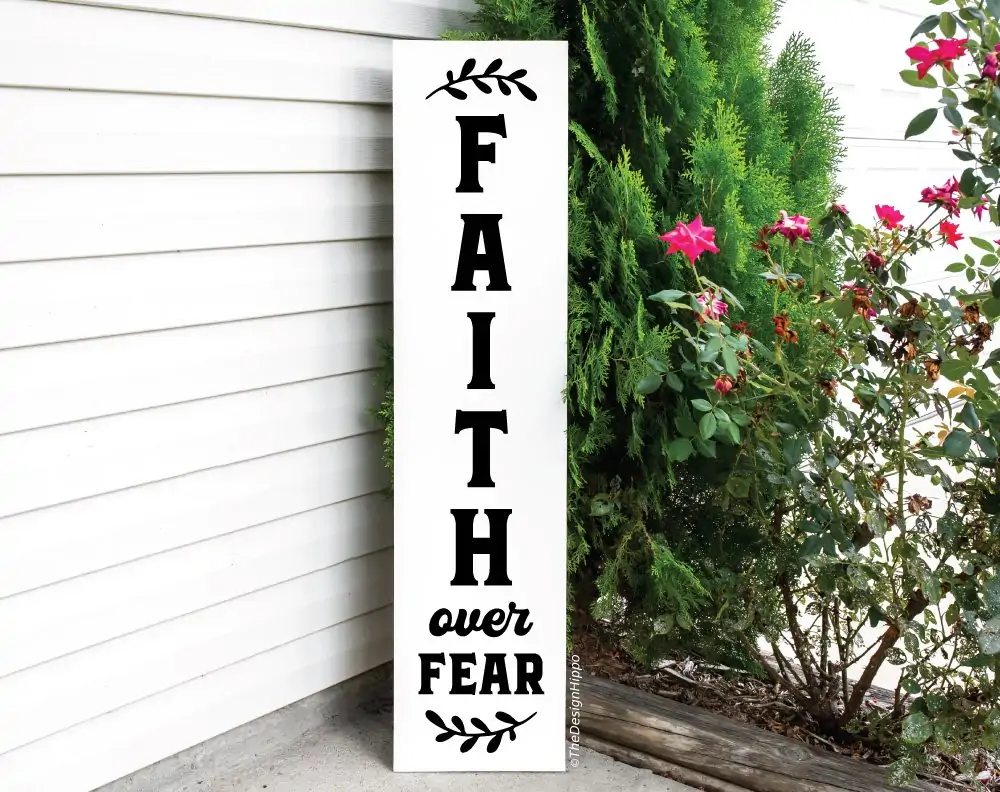 free faith SVG image, faith over fear with floral elements, displayed on a white vertical wood sign