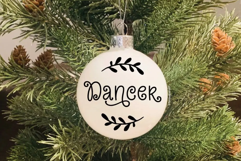 free Santa's reindeer names SVG design on a white Christmas ornament made using Cricut