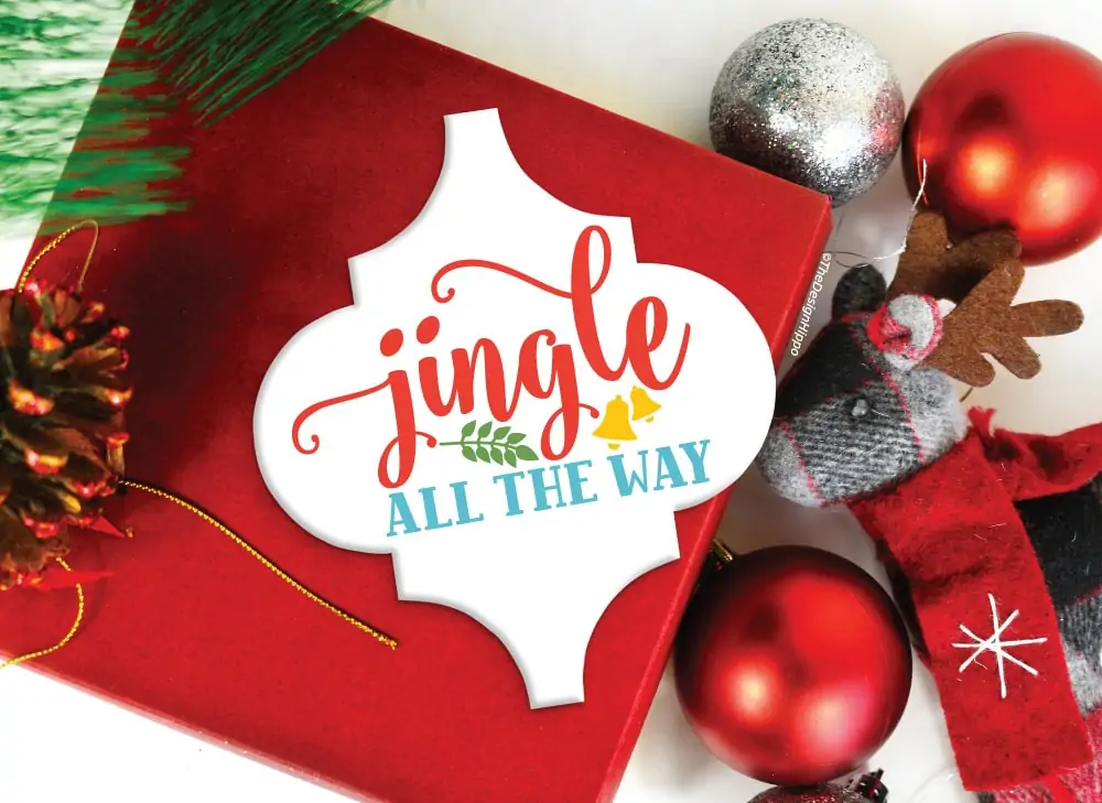 jingle all the way design displayed on arabesque ornament made with cricut maker