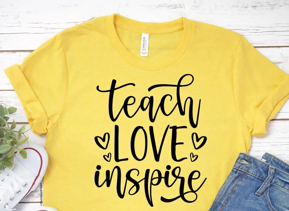 teacher love inspire SVG design mocked up on a yellow t-shirt