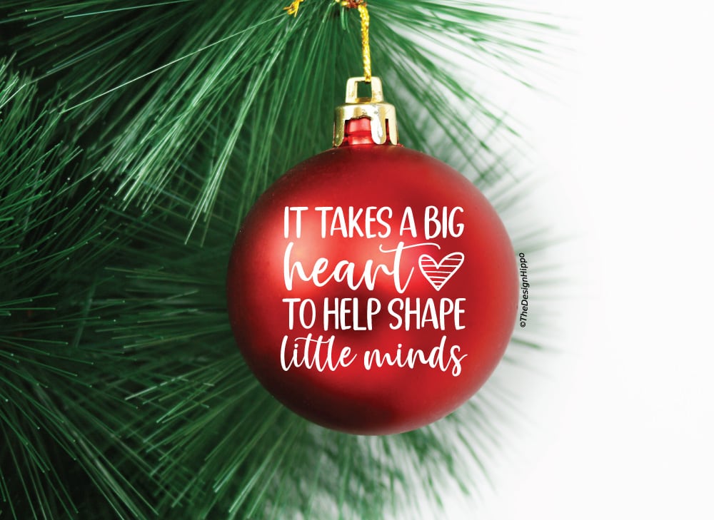 it takes a big heart SVG design displayed on a red Christmas ornament made with Cricut