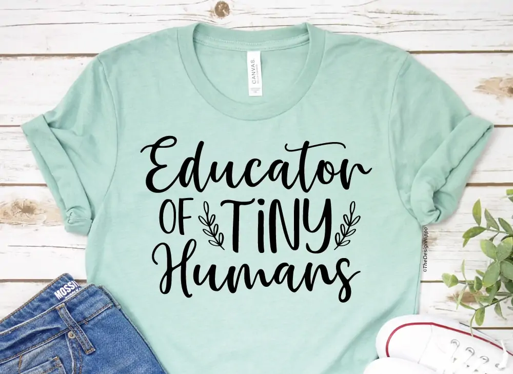 funny teacher SVG design on a light green t-shirt made with Cricut