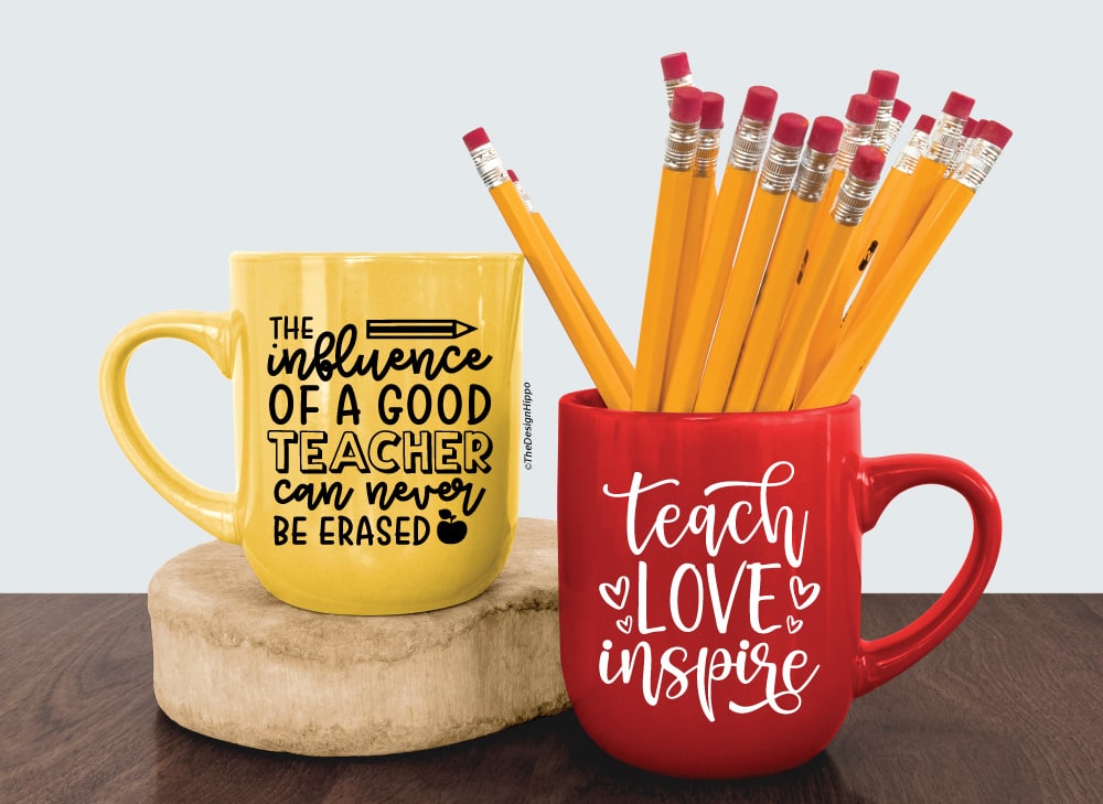 set of two free teacher SVG designs displayed on yellow and red coffee mugs