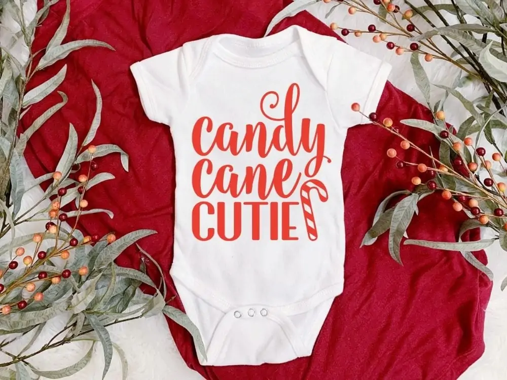 display of a Christmas design on a baby suit