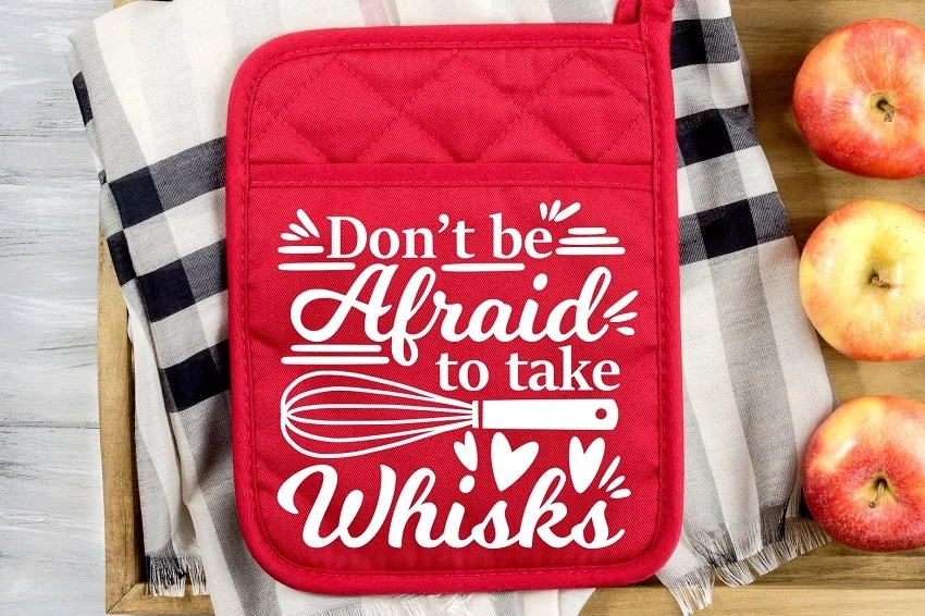 red pot holder with a funny quote made using cricut maker