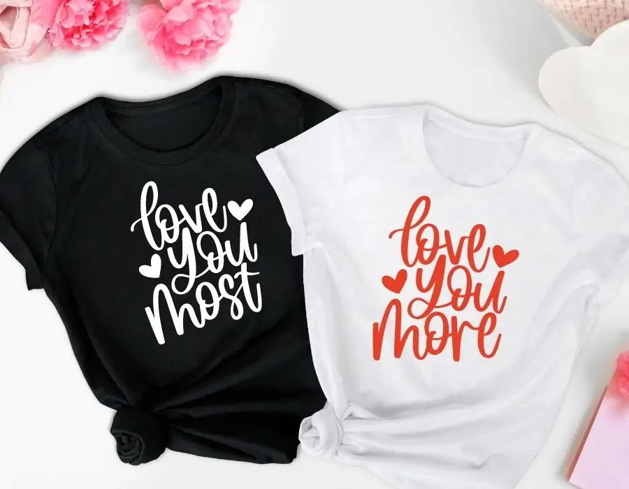 "Love You Most" and "Love Your More" designs displayed on a black and white t-shirts