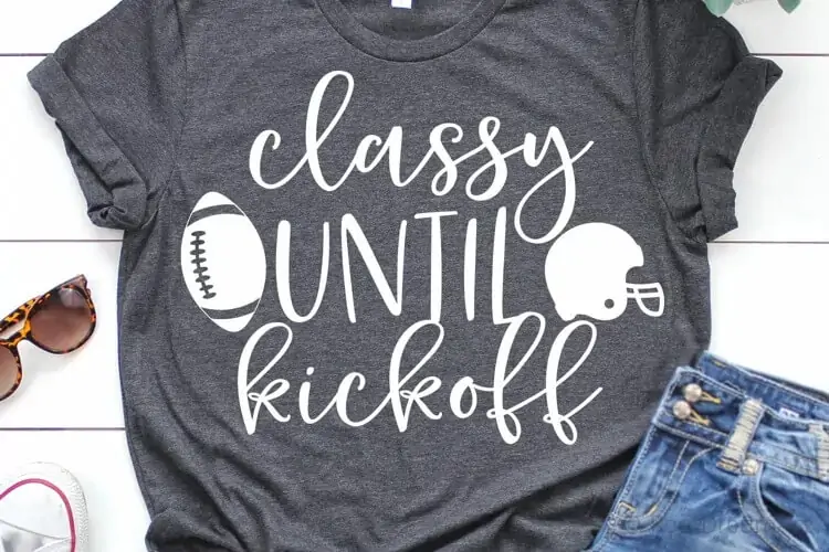 funny football mom svg design mocked up on a t-shirt