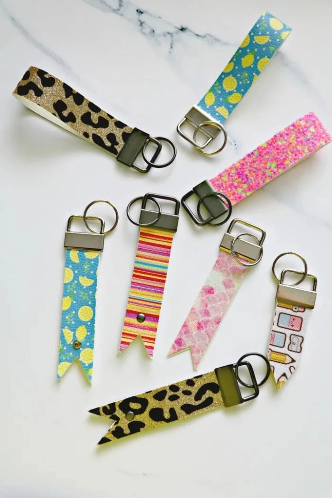 collage of DIY faux leather key fob keychains made with Cricut Maker
