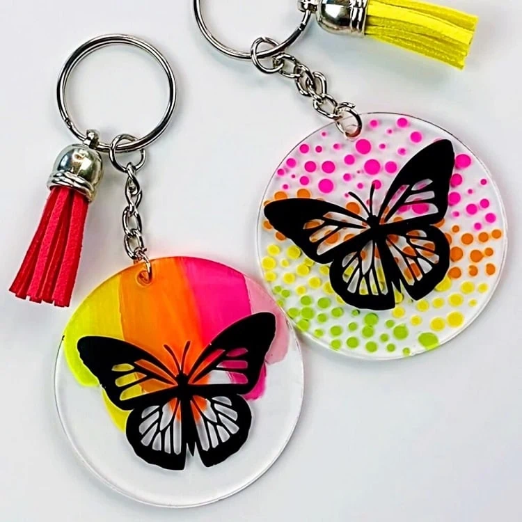 display of two easy and colorful round acrylic keychain projects made with Cricut Joy