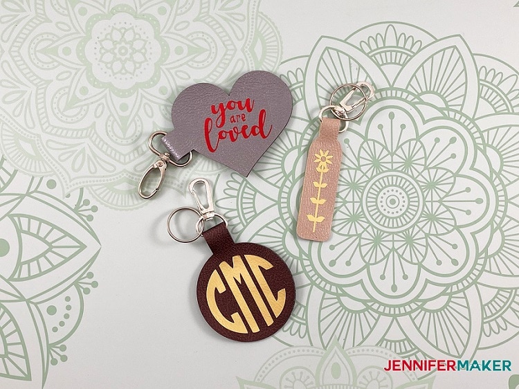display of three different leather keychains made with Cricut