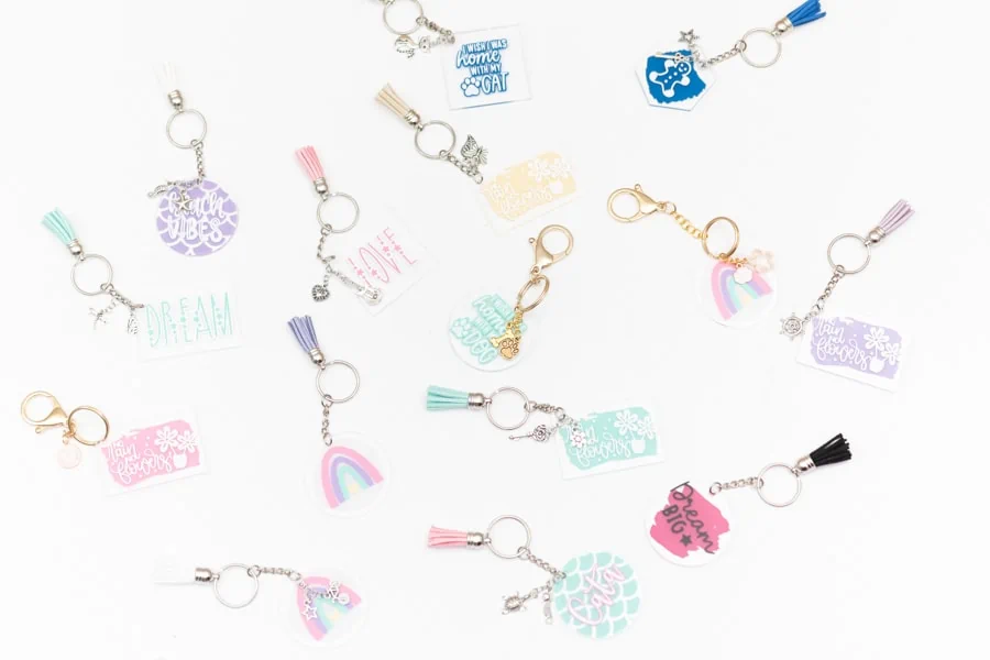 display of several free round acrylic keychain SVG designs on a white background