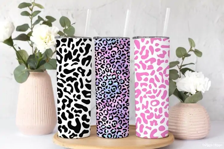 set of three skinny tumblers with different leopard patterns made with Cricut cutting machine