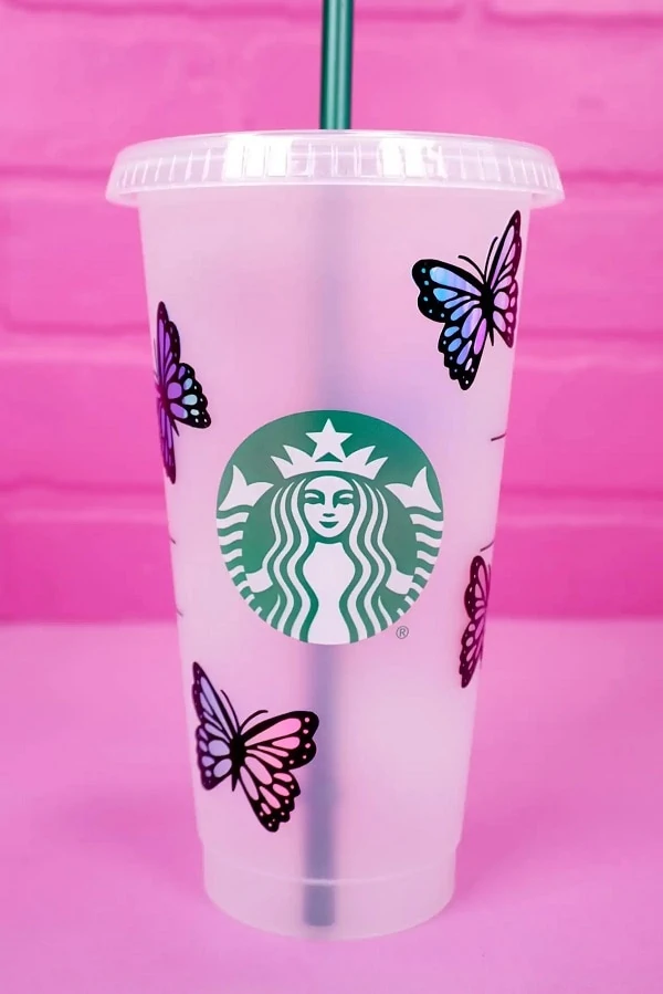 display of butterfly tumbler wrap SVG design on 24 oz Starbucks venti cold cup made using a Cricut cutting machine