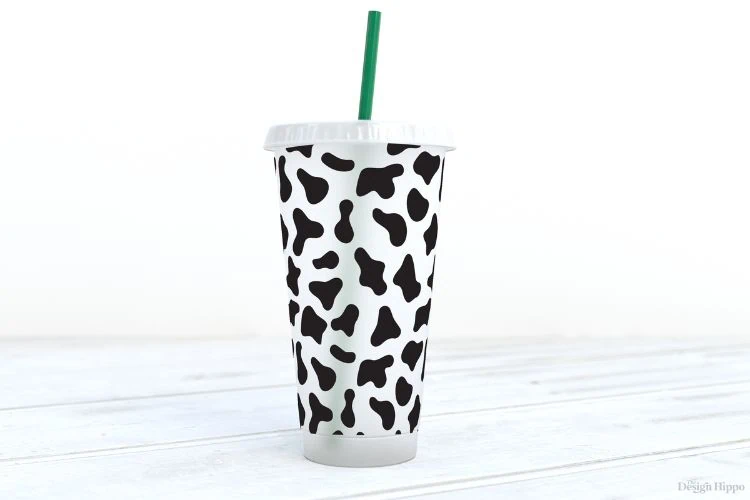 display of cow print pattern on 24 oz venti cold cup made with Cricut maker