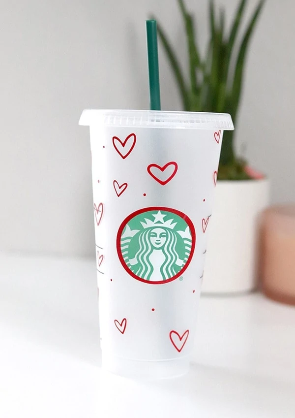 display of 24 oz Starbucks cold cup with hearts and polka dots design made using a Cricut