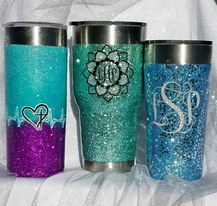 display of three epoxy glitter tumbler ideas that can be made using a Cricut machine