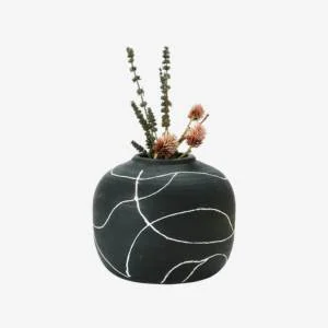 Black ceramic vase with white linear pattern