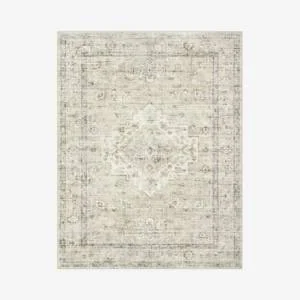 Neutral vintage-inspired area rug with distressed pattern in beige and gray
