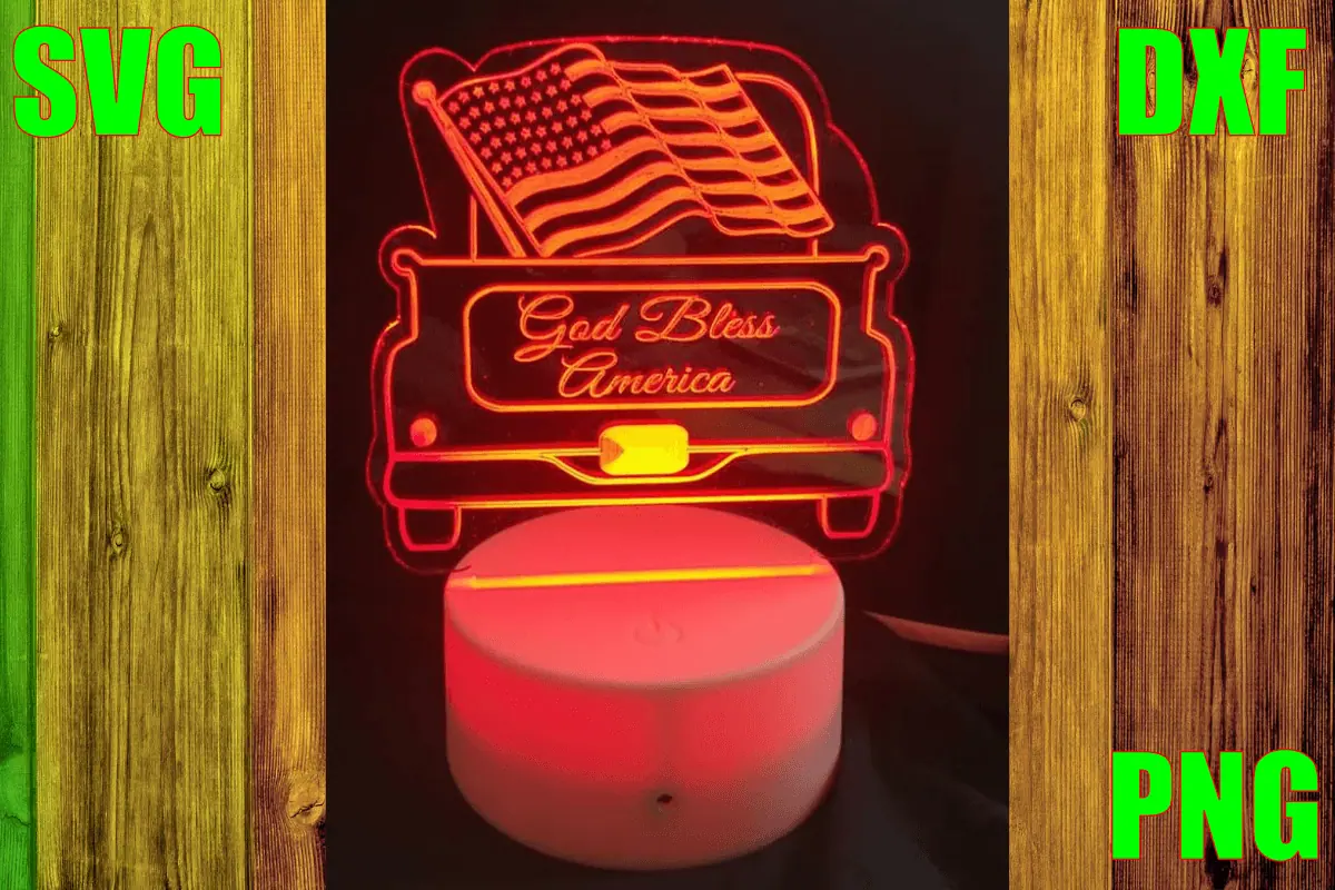 engraved acrylic lamp of a vintage truck carrying an American flag that says God bless America, glowing red