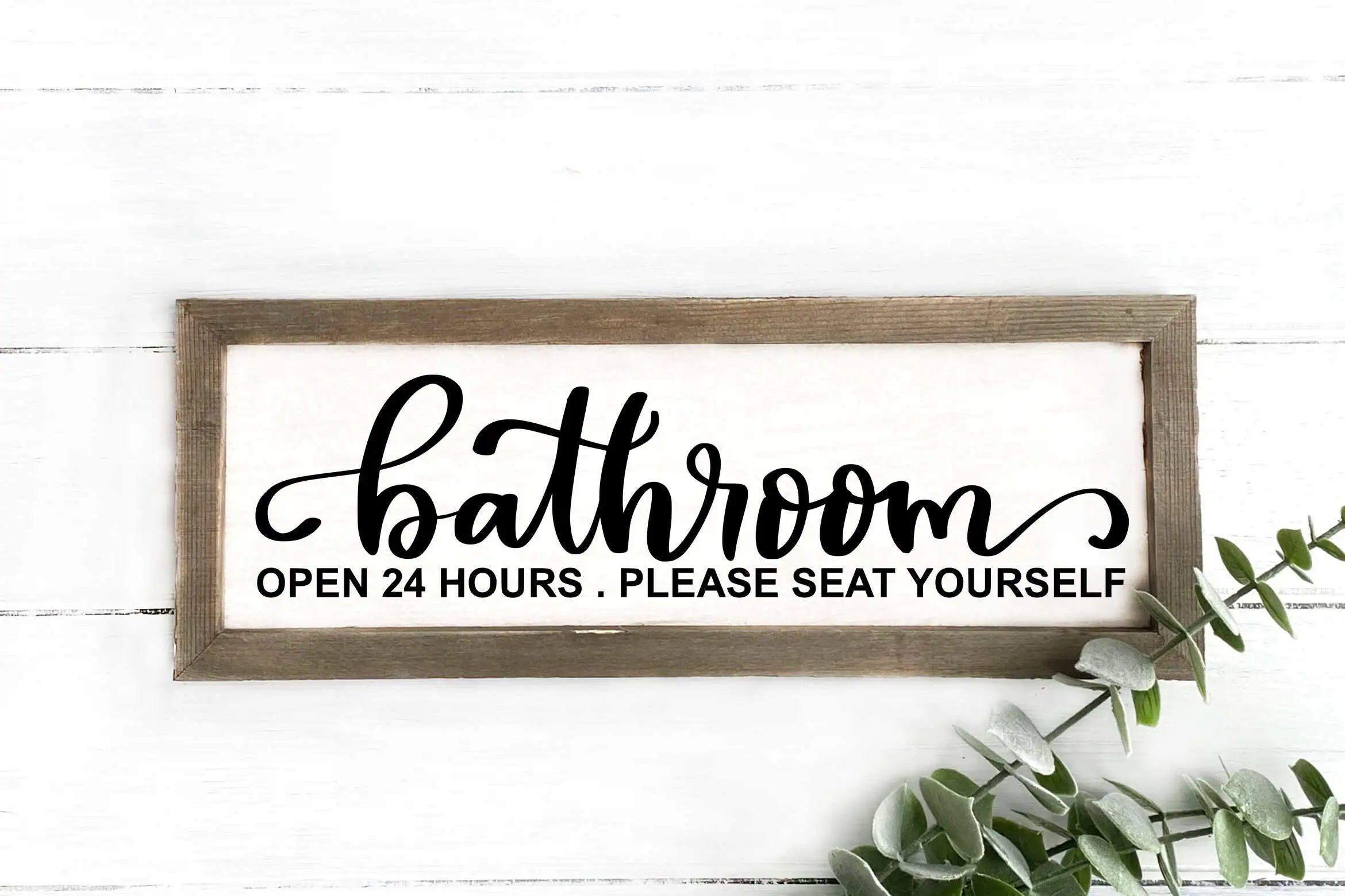 long wood framed sign that says bathroom, open 24 hours, please seat yourself