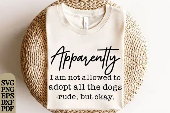 cream t-shirt that says apparently I am not allowed to adopt all the dogs, rude but okay
