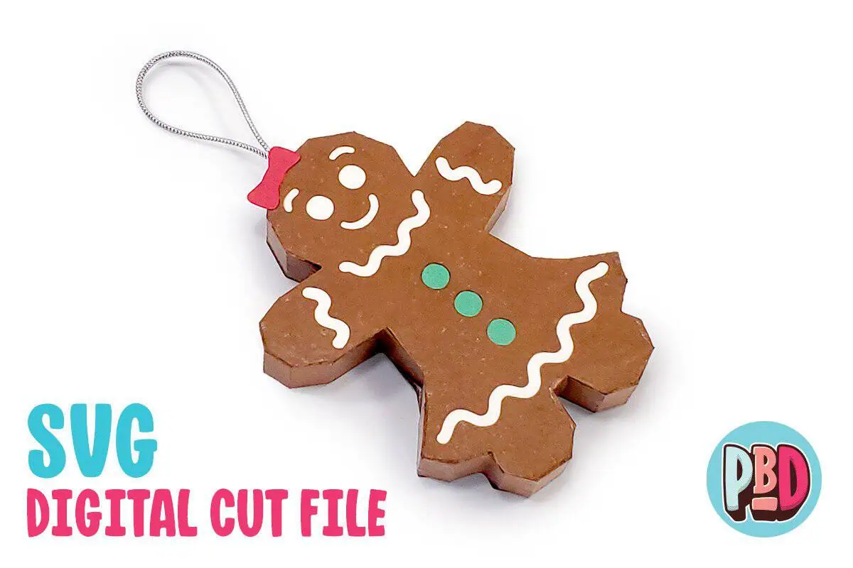 3D paper gingerbread girl ornament with white icing details and a red bow