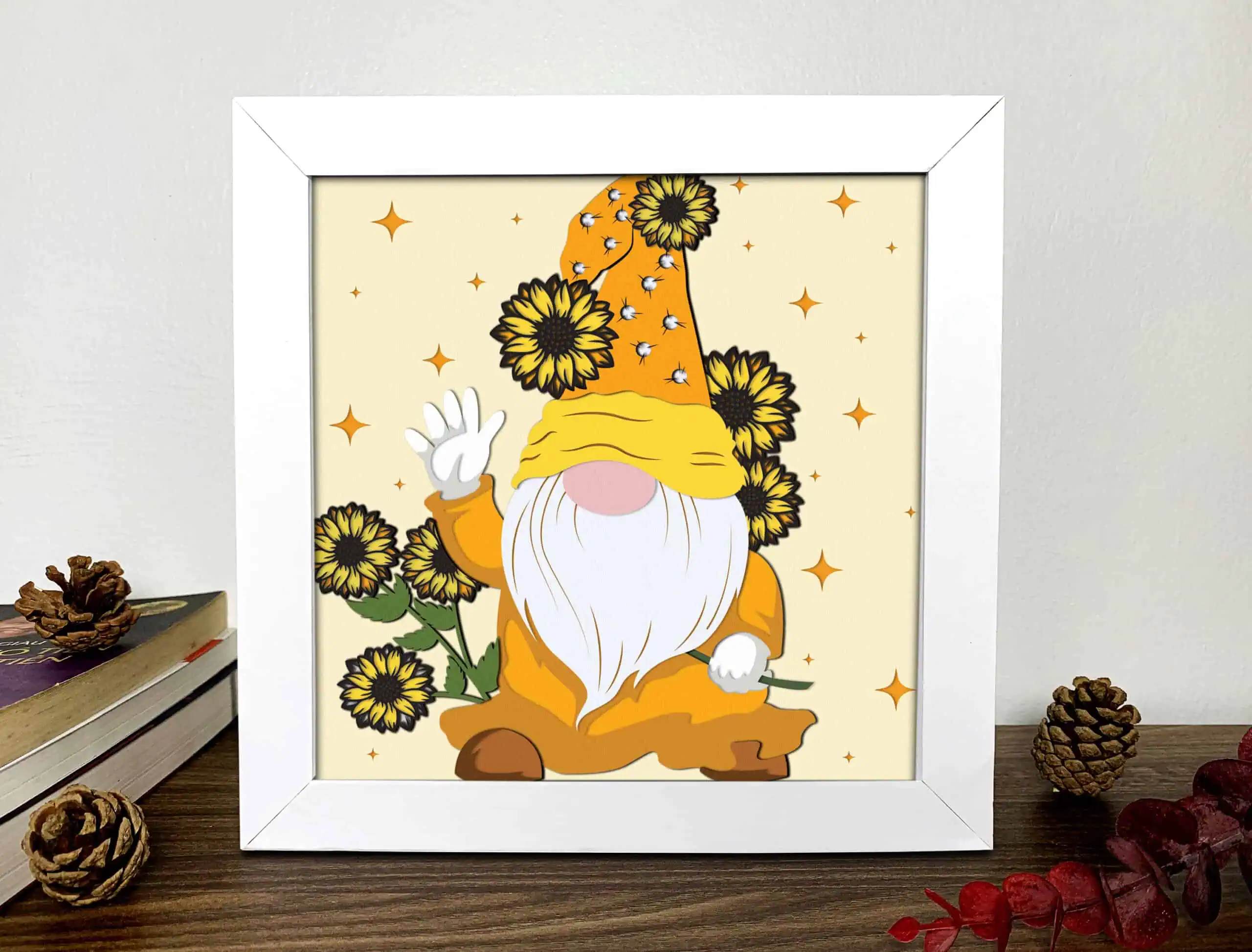 layered shadow box of a waving gnome with a sunflower hat on a cream background
