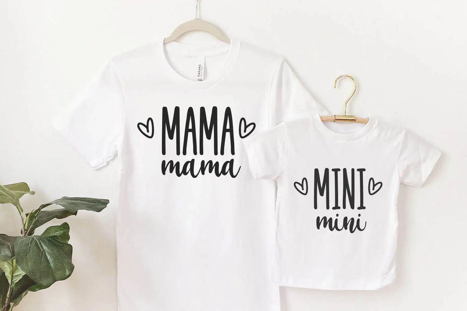 white mama and mini matching t-shirts with little hearts hanging side by side