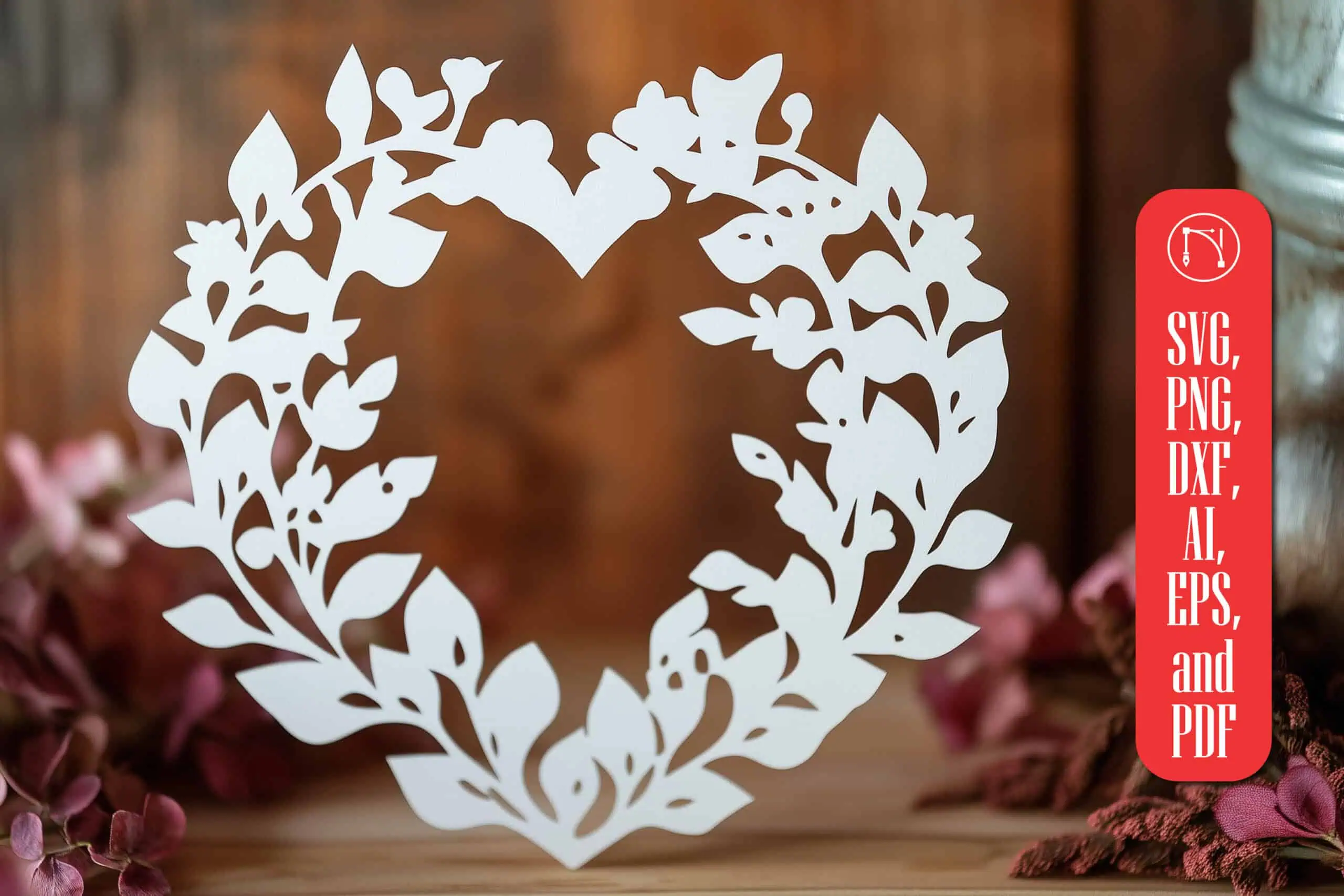white paper cut heart-shaped wreath made of leaves on a dark wood background