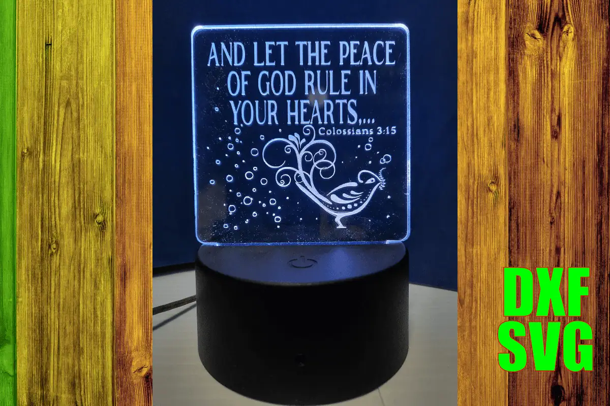 engraved acrylic lamp that says and let the peace of God rule in your hearts with a dove, glowing white