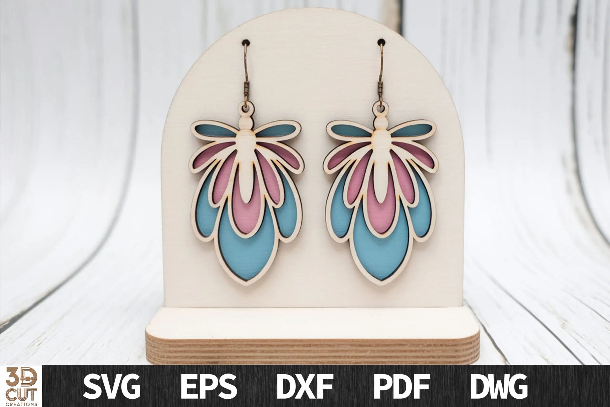 layered petal earrings in pink and blue on a cream earring card