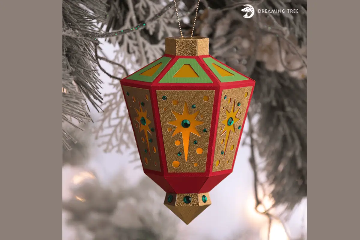 red and gold 3D paper lantern ornament with star cutouts
