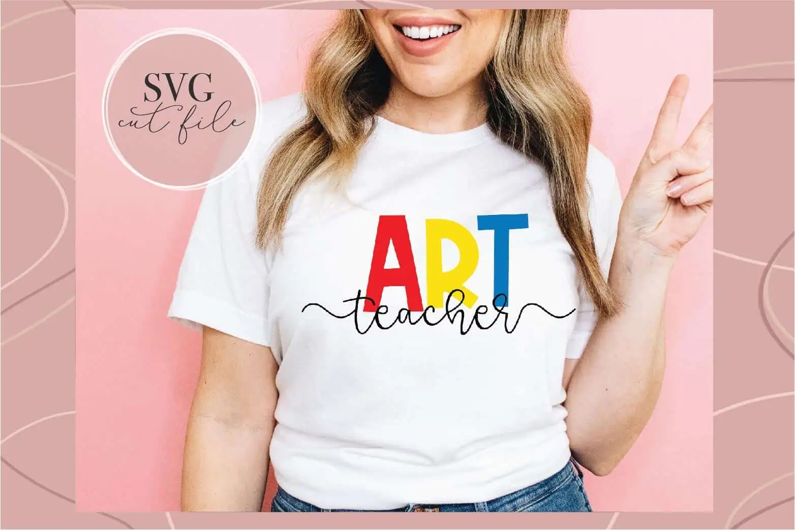 white t-shirt with ART in rainbow letters and teacher in script underneath
