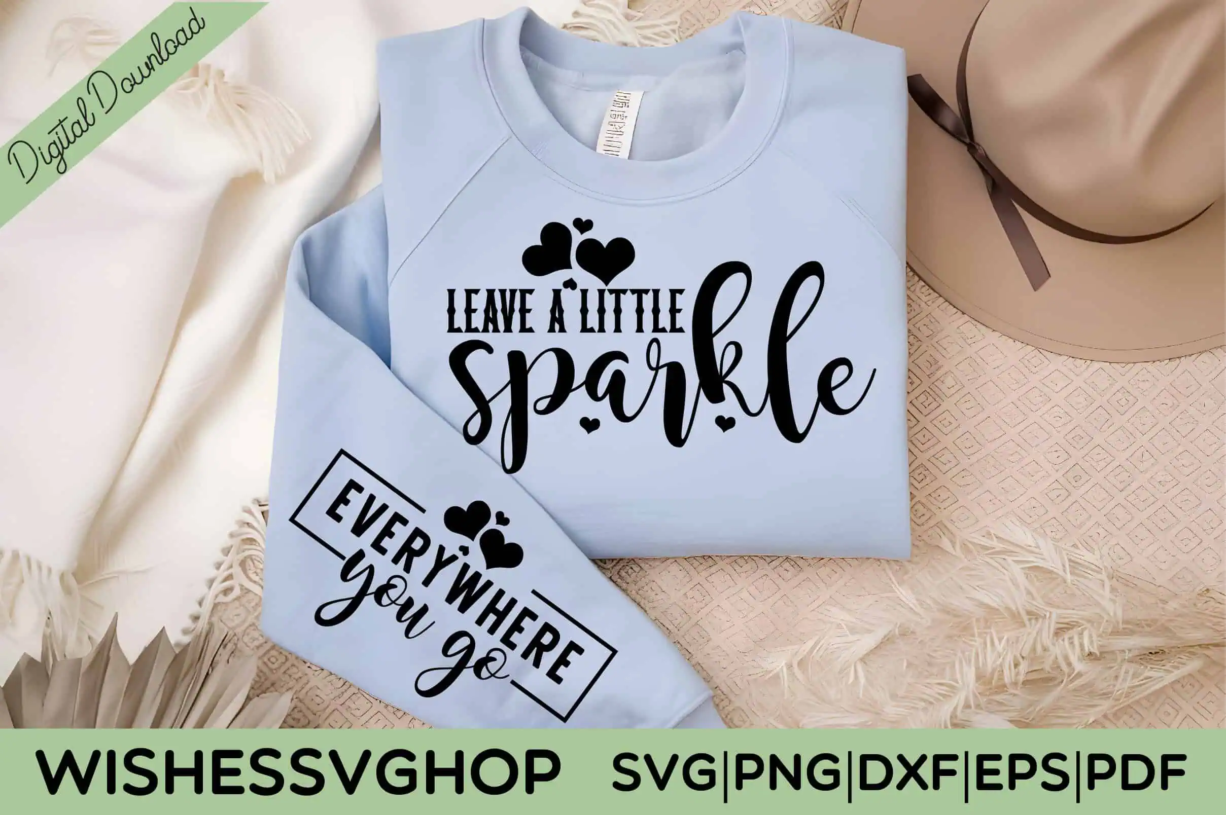 light blue sweatshirt that says leave a little sparkle with everywhere you go on the sleeve